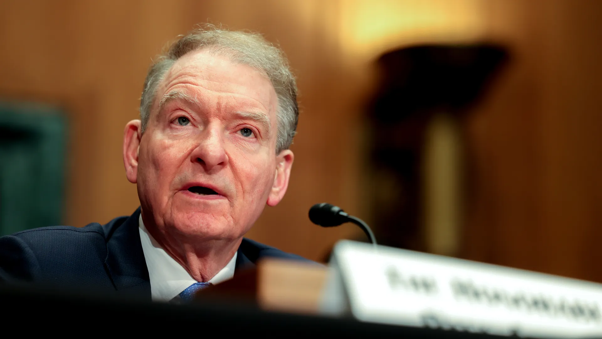 A image of a concrete sphere, balanced between two other larger spheres